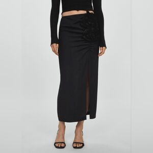 Skirt with slit and floral appliqué